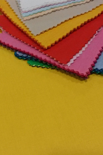 Tessuto UNI in cotone giallo